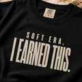 Soft Era I Earned It graphic tee shown in an alternate color