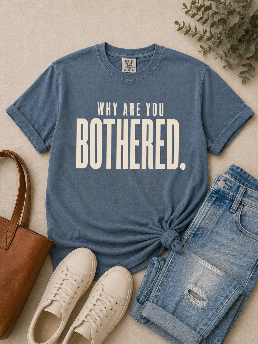 Woman wearing the Why Are You Bothered graphic tee in a premium lifestyle look