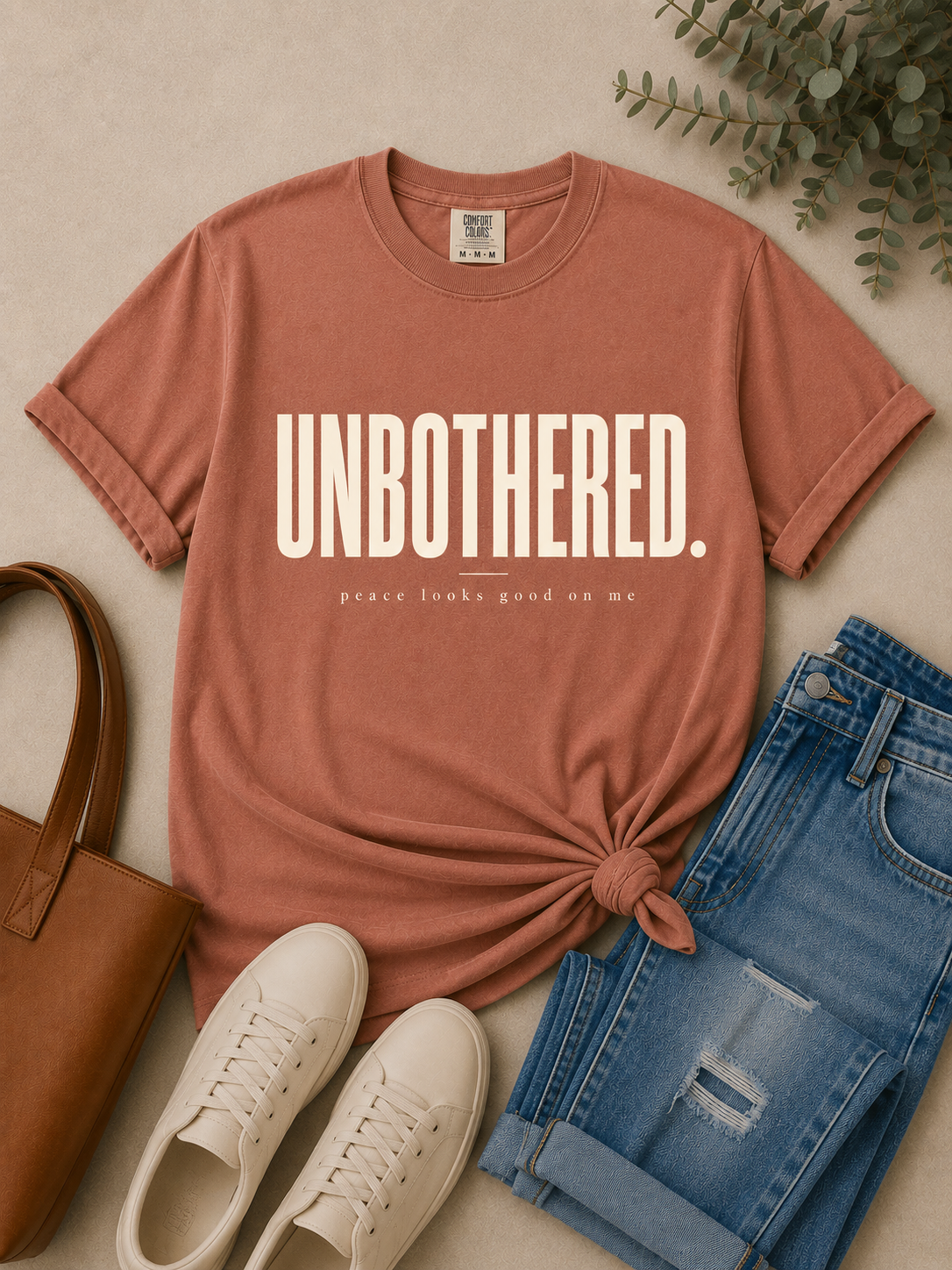 Unbothered women's tee shown in a full lifestyle outfit