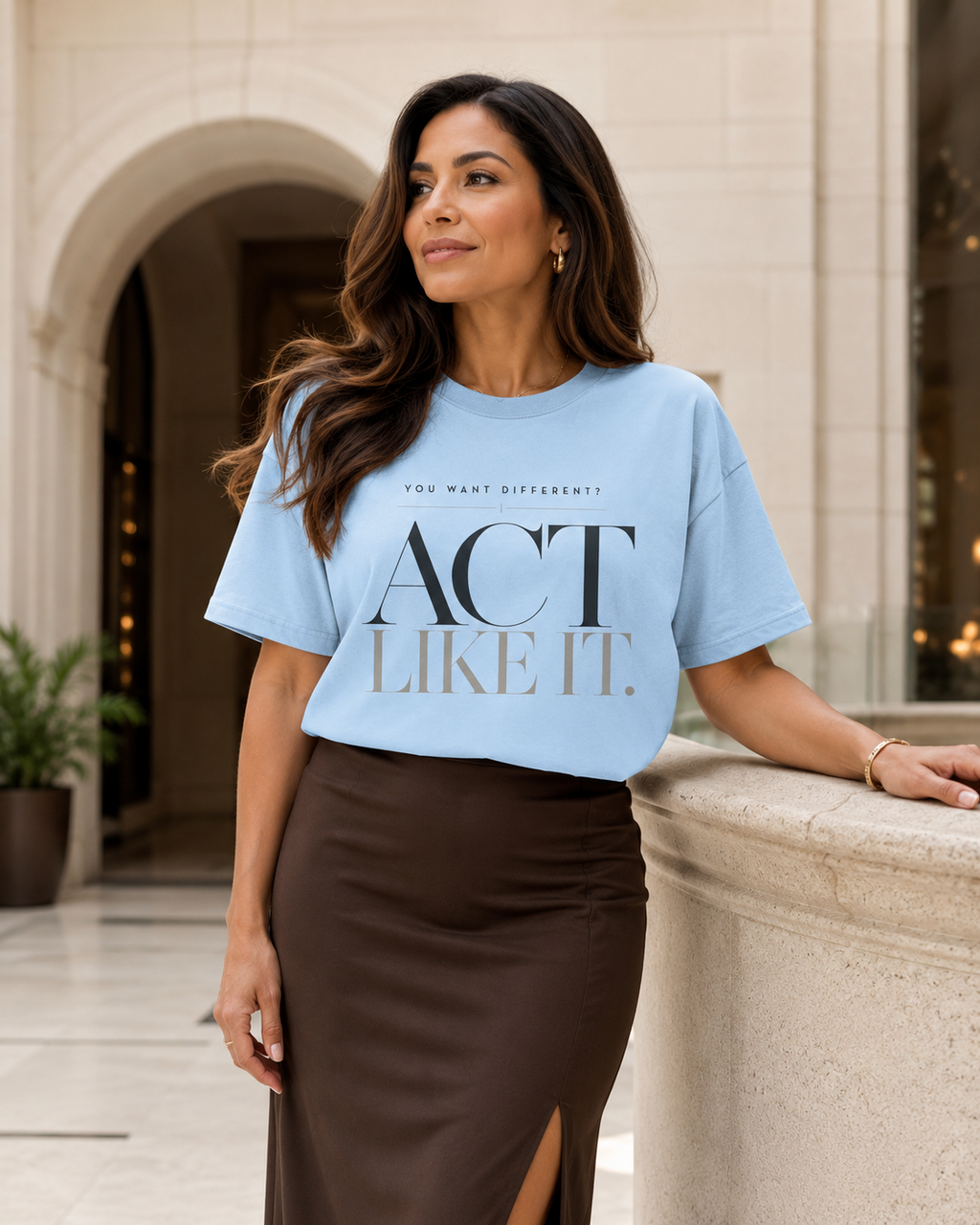 Woman wearing the Act Like It statement tee in chambray with a chocolate midi skirt