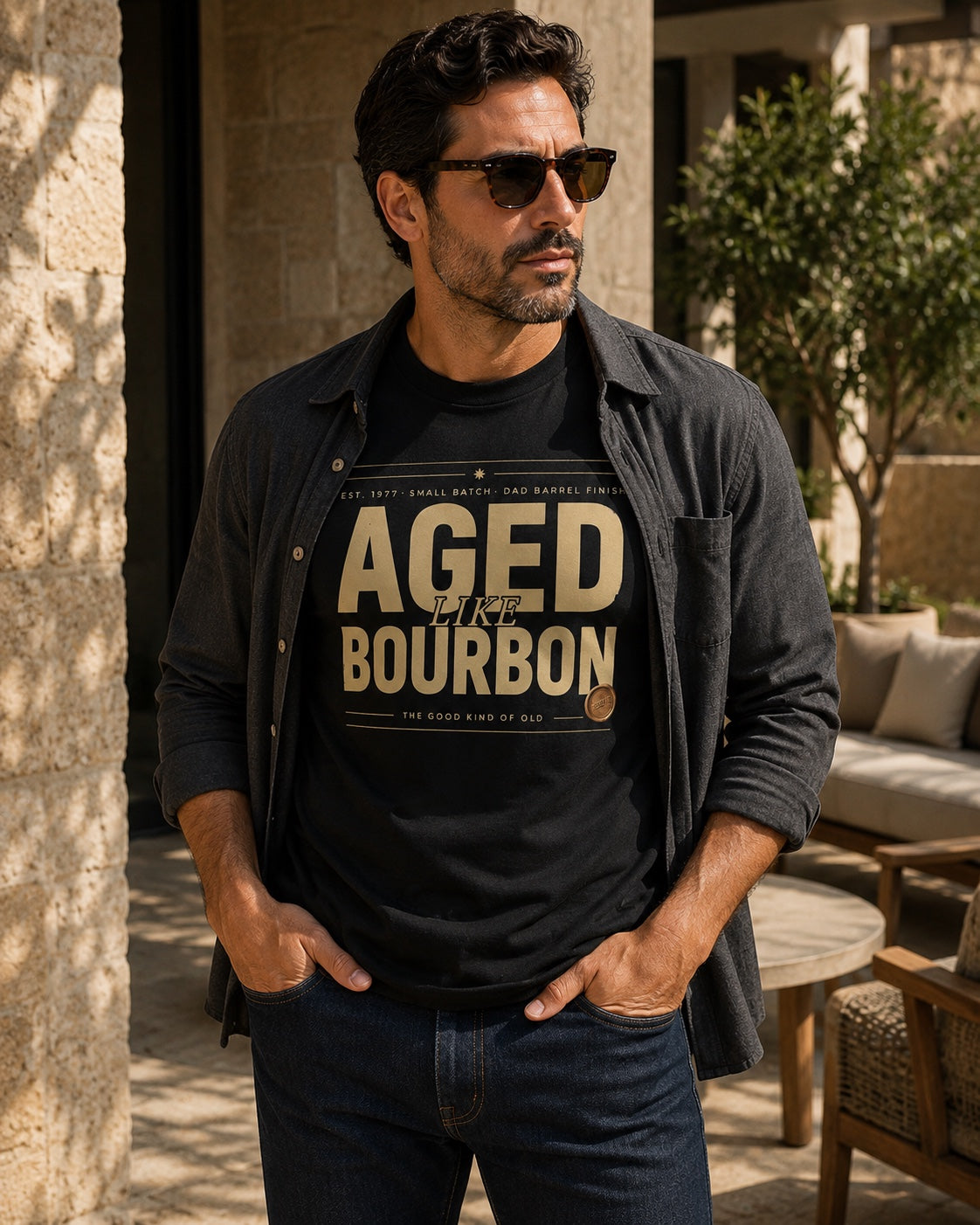 Male model wearing the personalized Aged Like Bourbon black tee layered with a charcoal overshirt