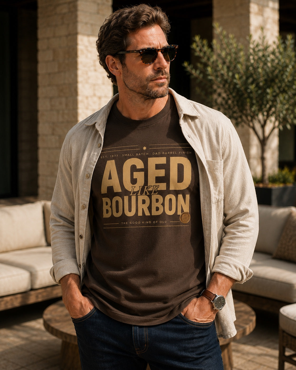 Male model wearing the Aged Like Bourbon personalized hunter brown tee with an open overshirt