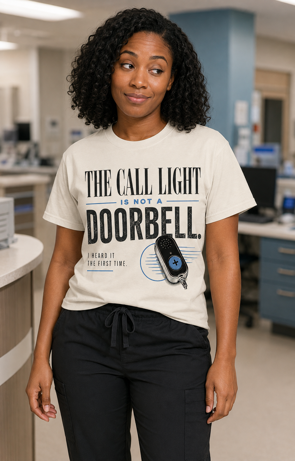 African American nurse wearing Ivory Call Light Is Not a Doorbell tee with black scrub pants