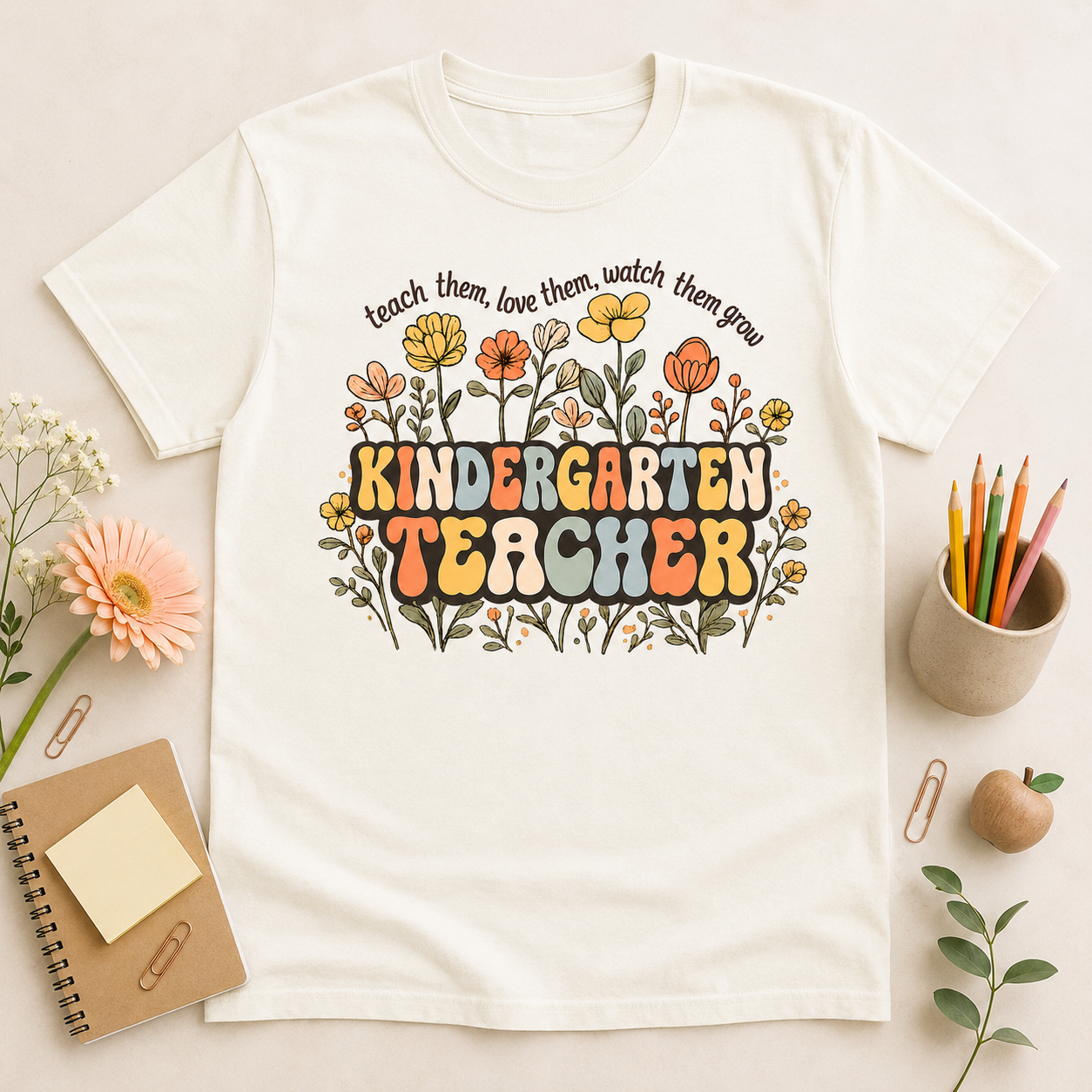 Kindergarten floral teacher tee in Ivory styled flat lay