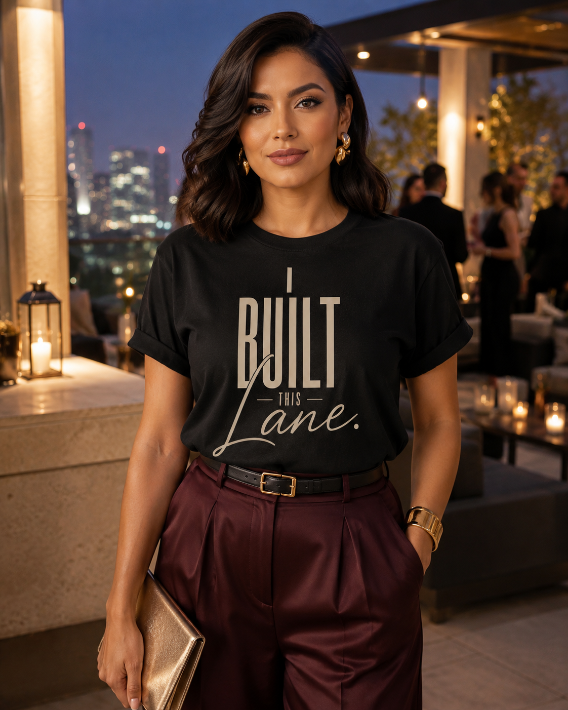 Hispanic woman wearing the I Built This Lane black statement tee styled for cocktail hour