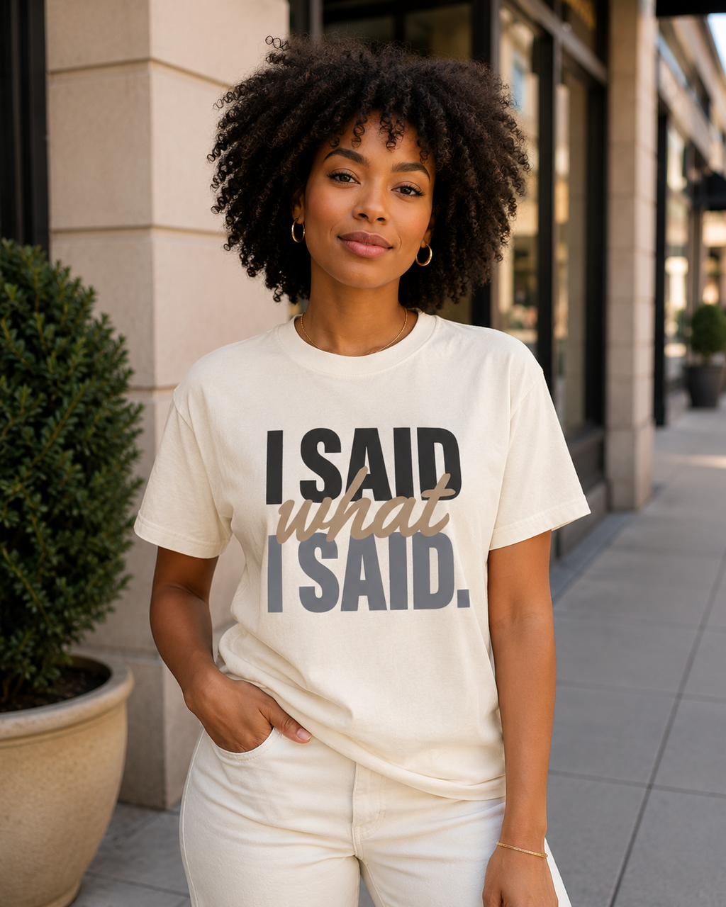 Woman wearing the I Said What I Said statement tee in Comfort Colors Ivory in an upscale outdoor setting.