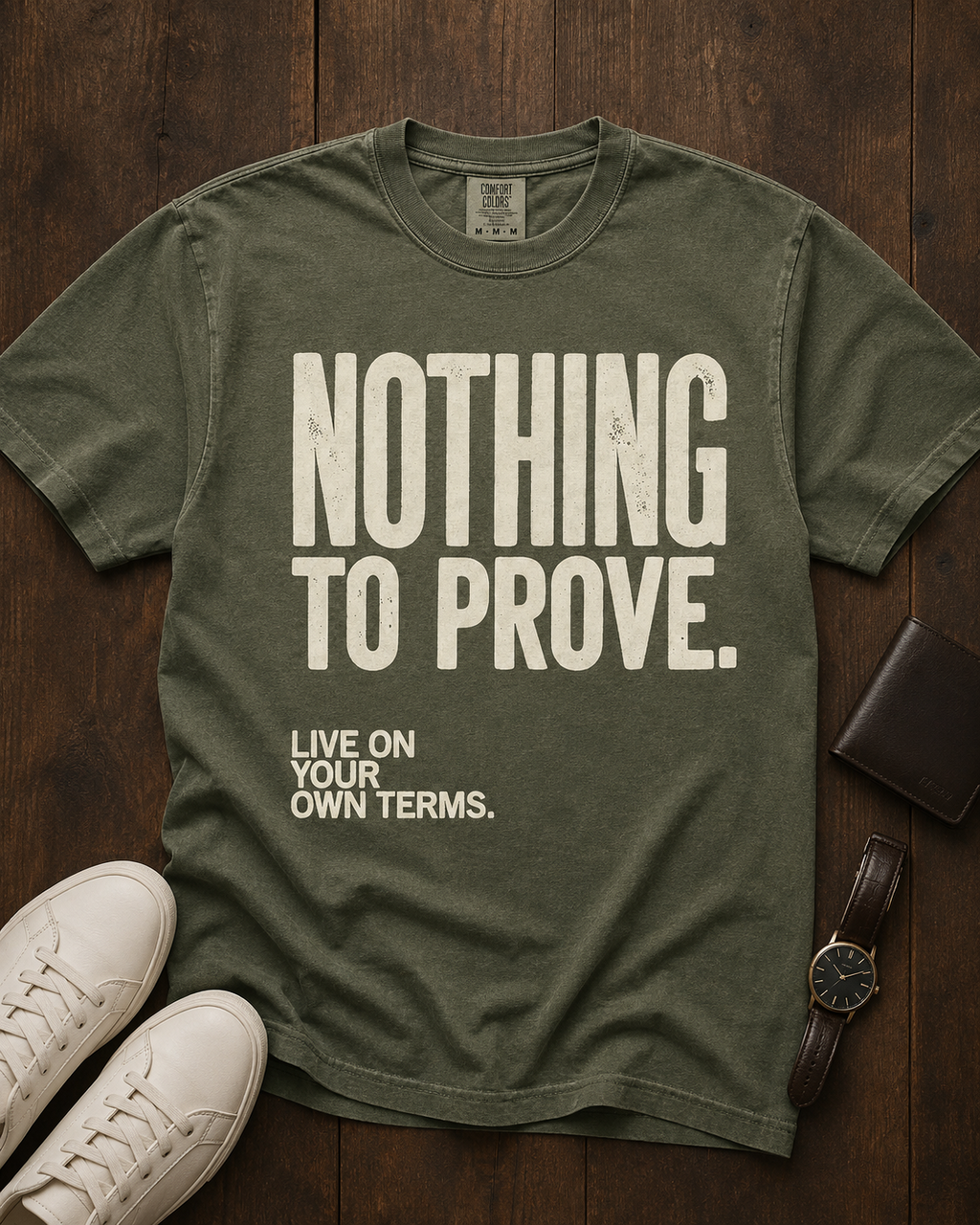 Nothing to Prove men's graphic tee in Moss, styled editorial flat lay