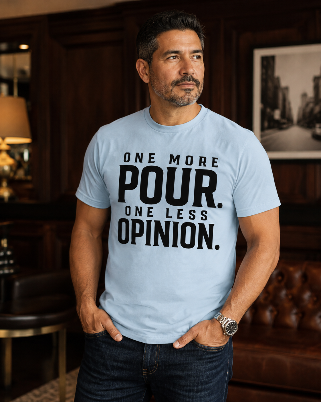 Hispanic man wearing One More Pour One Less Opinion statement tee in Chambray