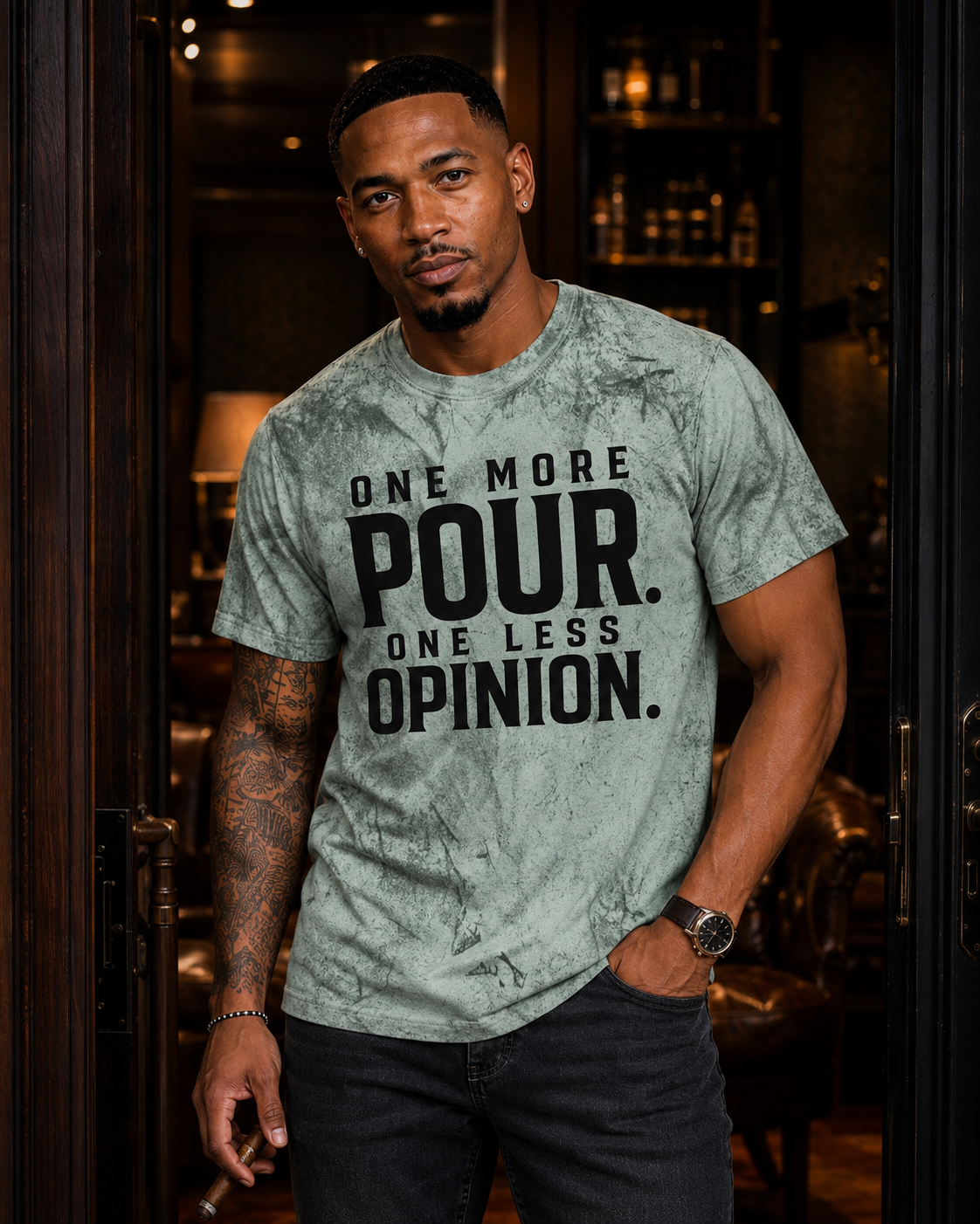 Light-complexion Black man wearing One More Pour One Less Opinion statement tee in green Color Blast wash