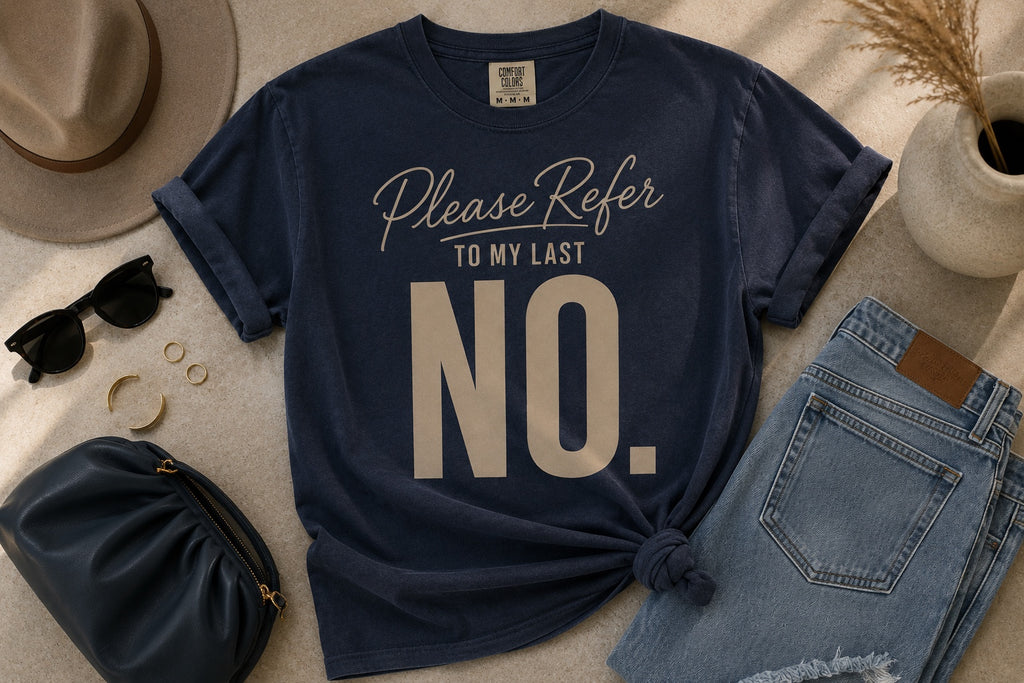 Comfort Colors Midnight Navy Please Refer to My Last No. statement tee styled in an editorial flat lay.