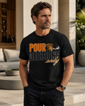 White male model wearing the Pour Decisions Only black graphic tee in a bright editorial lounge setting