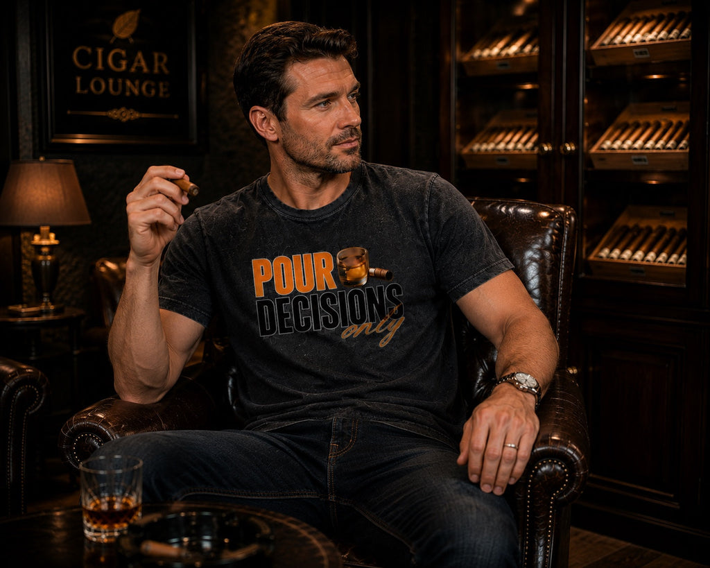 Male model wearing the Pour Decisions Only black graphic tee seated in a cigar lounge