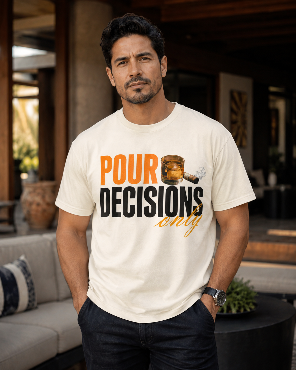 Hispanic male model wearing the Pour Decisions Only ivory graphic tee in a premium editorial lounge setting