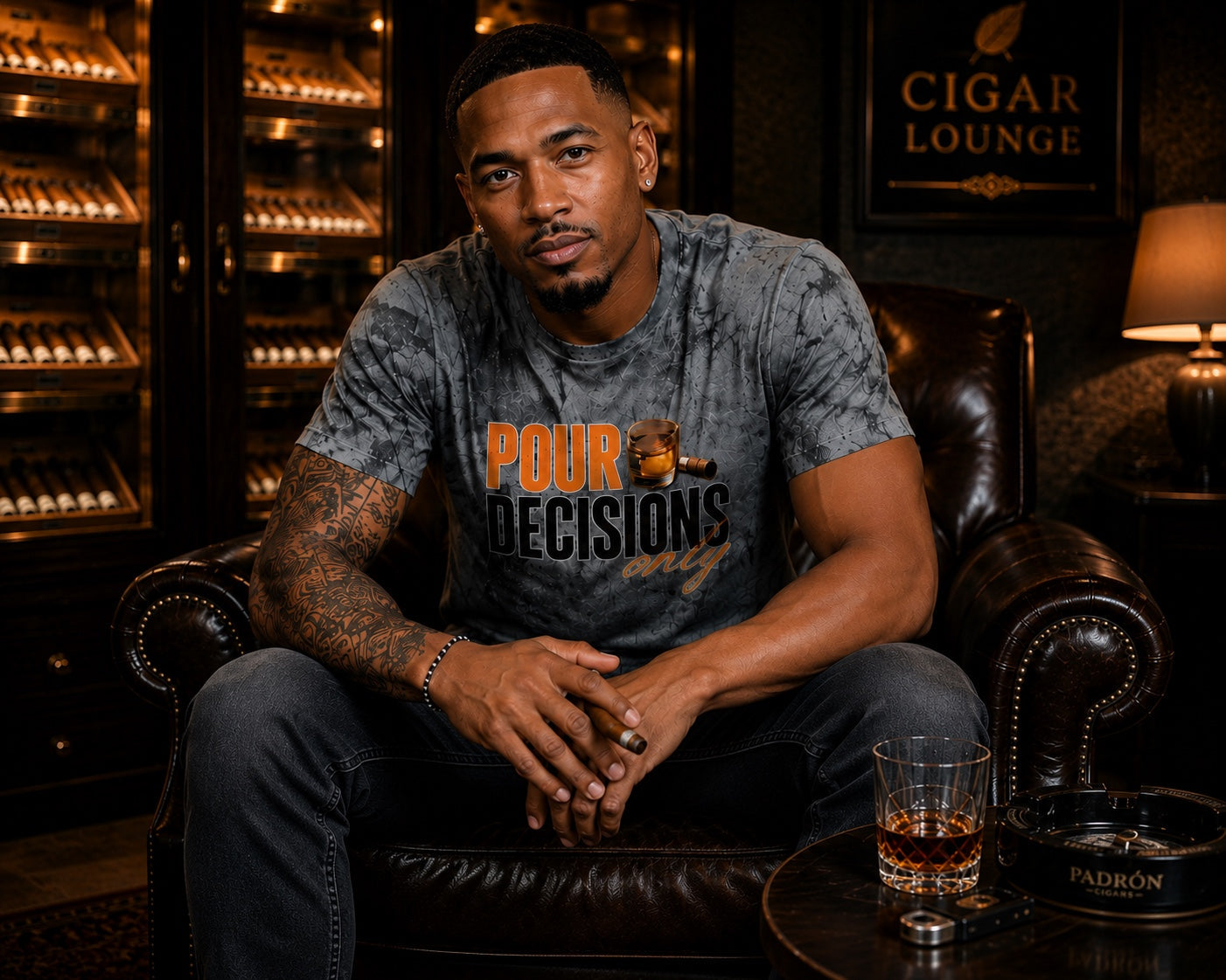 Black male model wearing the Pour Decisions Only smoke gray graphic tee in a cigar lounge