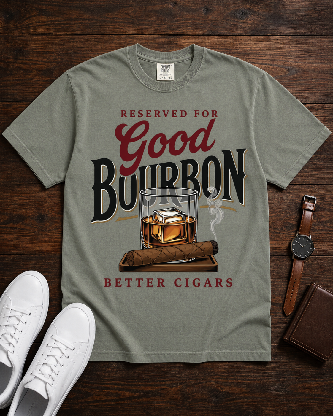 Reserved for Good Bourbon Better Cigars tee in moss styled flat lay