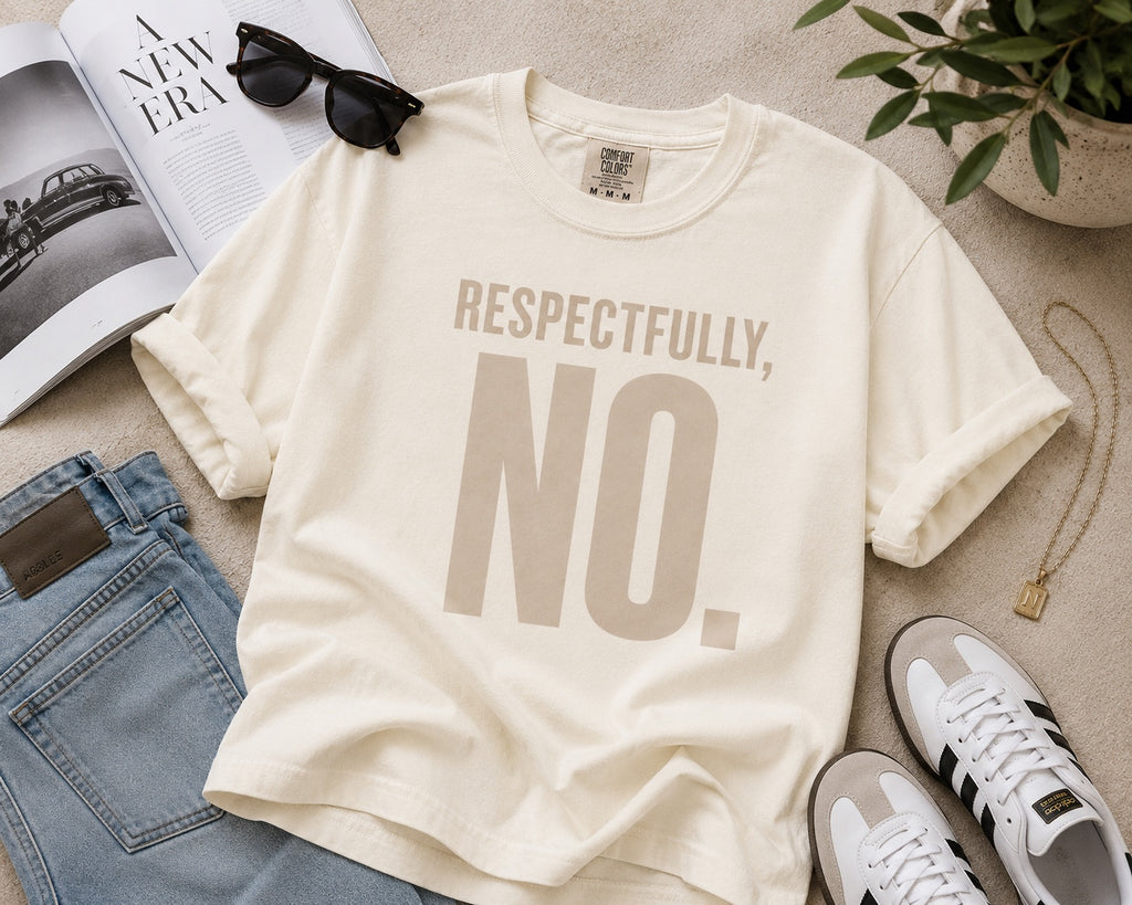 Comfort Colors Ivory Respectfully, No. statement tee styled in an editorial flat lay.