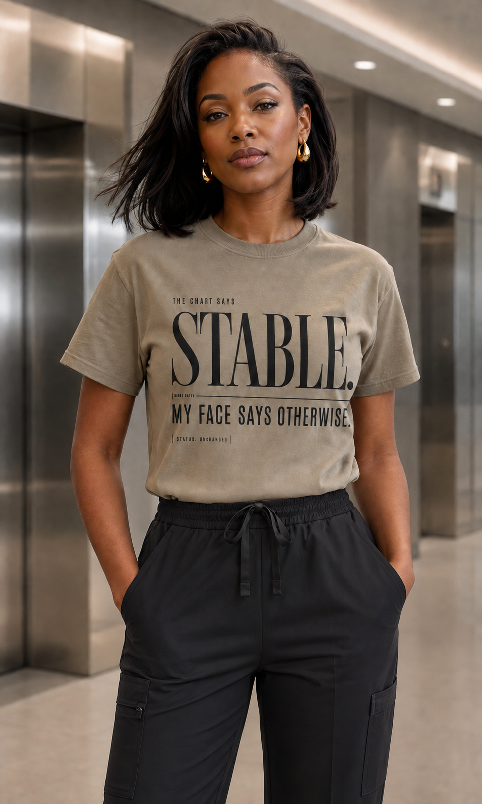 Nurse wearing Khaki Stable My Face Says Otherwise tee with black scrub pants