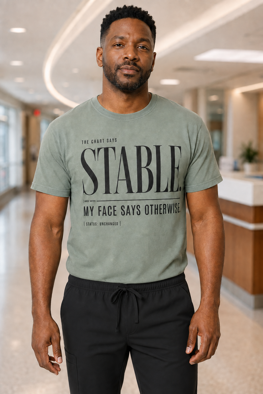 Male nurse wearing Sage Stable My Face Says Otherwise tee with black scrub pants