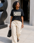 African American woman wearing the This Version Was Chosen statement tee in black with cream typography