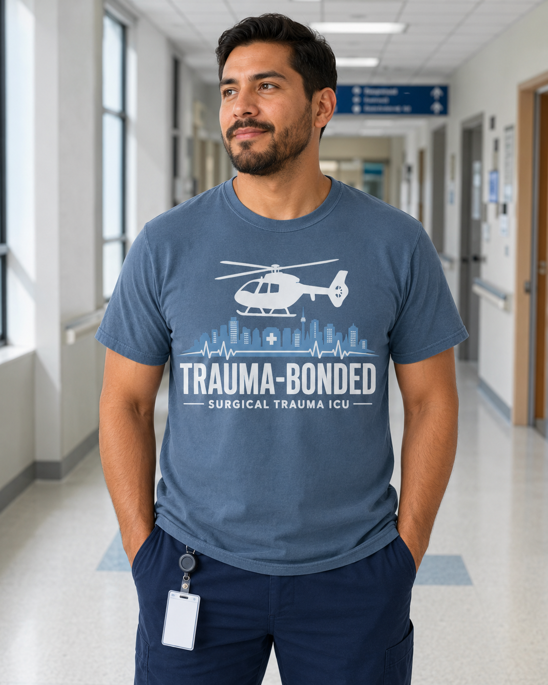 Trauma Bonded Surgical Trauma ICU tee in Comfort Colors Blue Jean on Hispanic male nurse