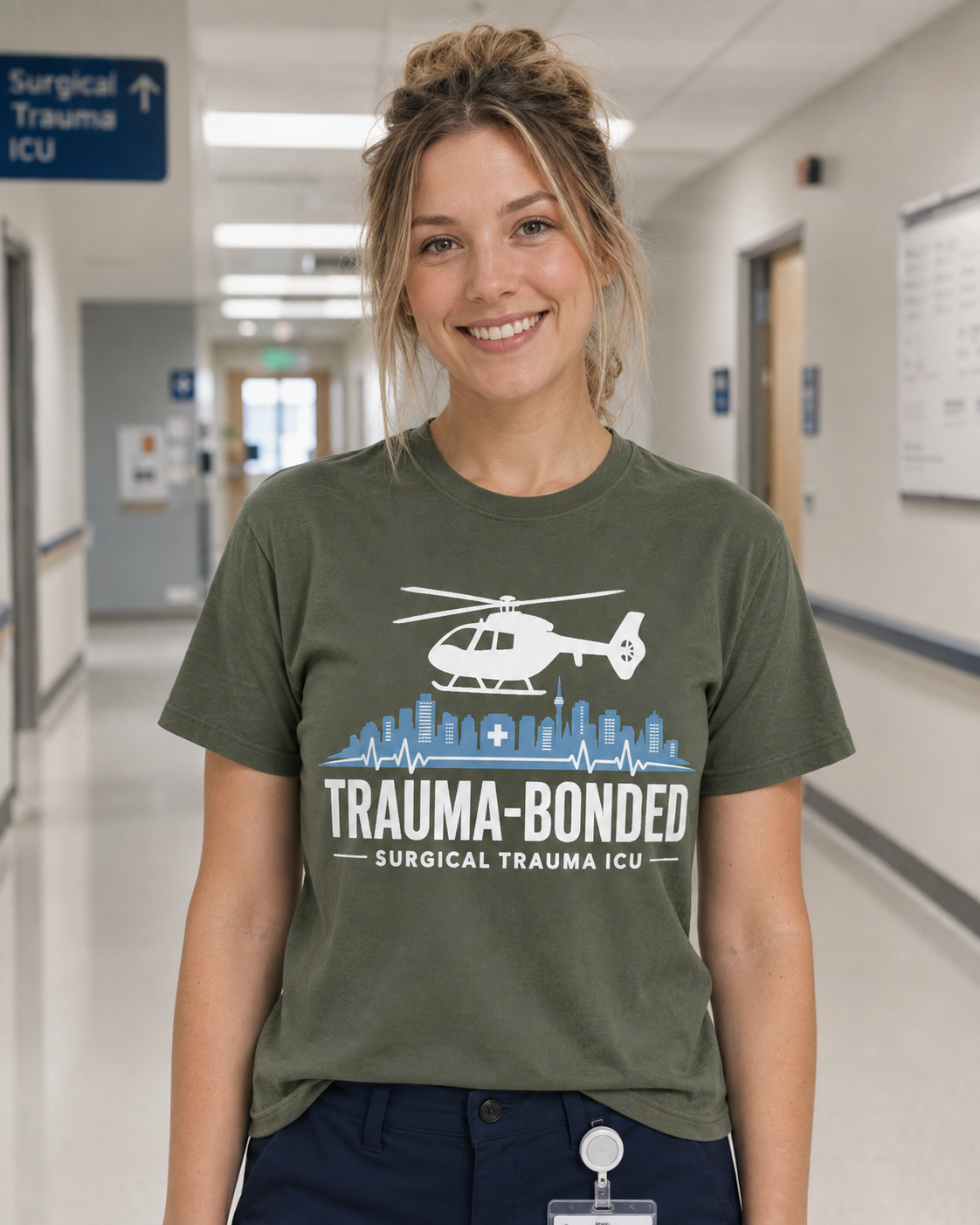 Trauma Bonded Surgical Trauma ICU tee in Comfort Colors Moss on Caucasian nurse