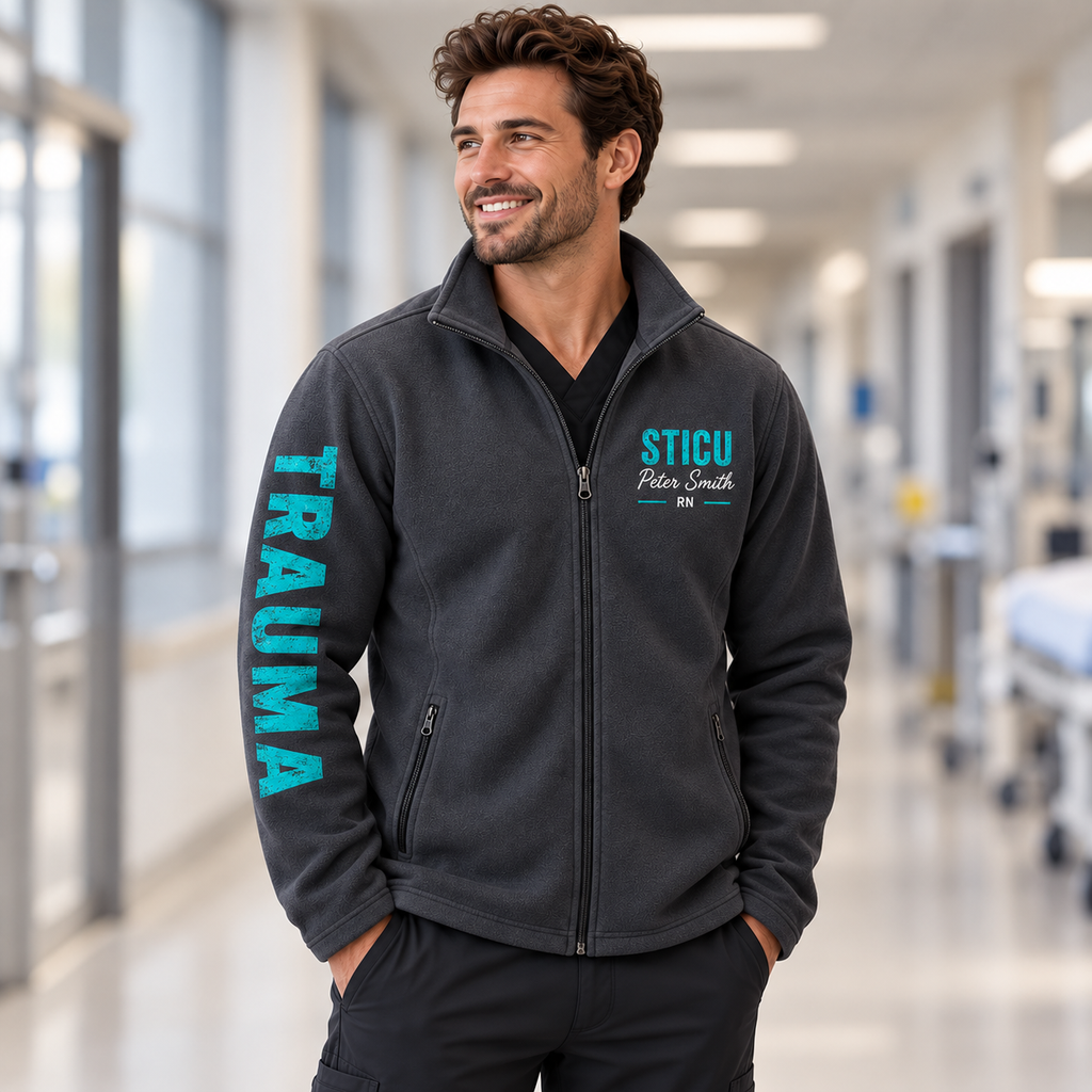 Male nurse wearing Iron Gate Gray Trauma-Bonded personalized unisex jacket, front view