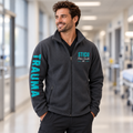 Male nurse wearing Iron Gate Gray Trauma-Bonded personalized unisex jacket, front view