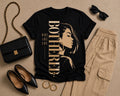 Why Are You Bothered illustrated black statement tee flat lay with neutral accessories